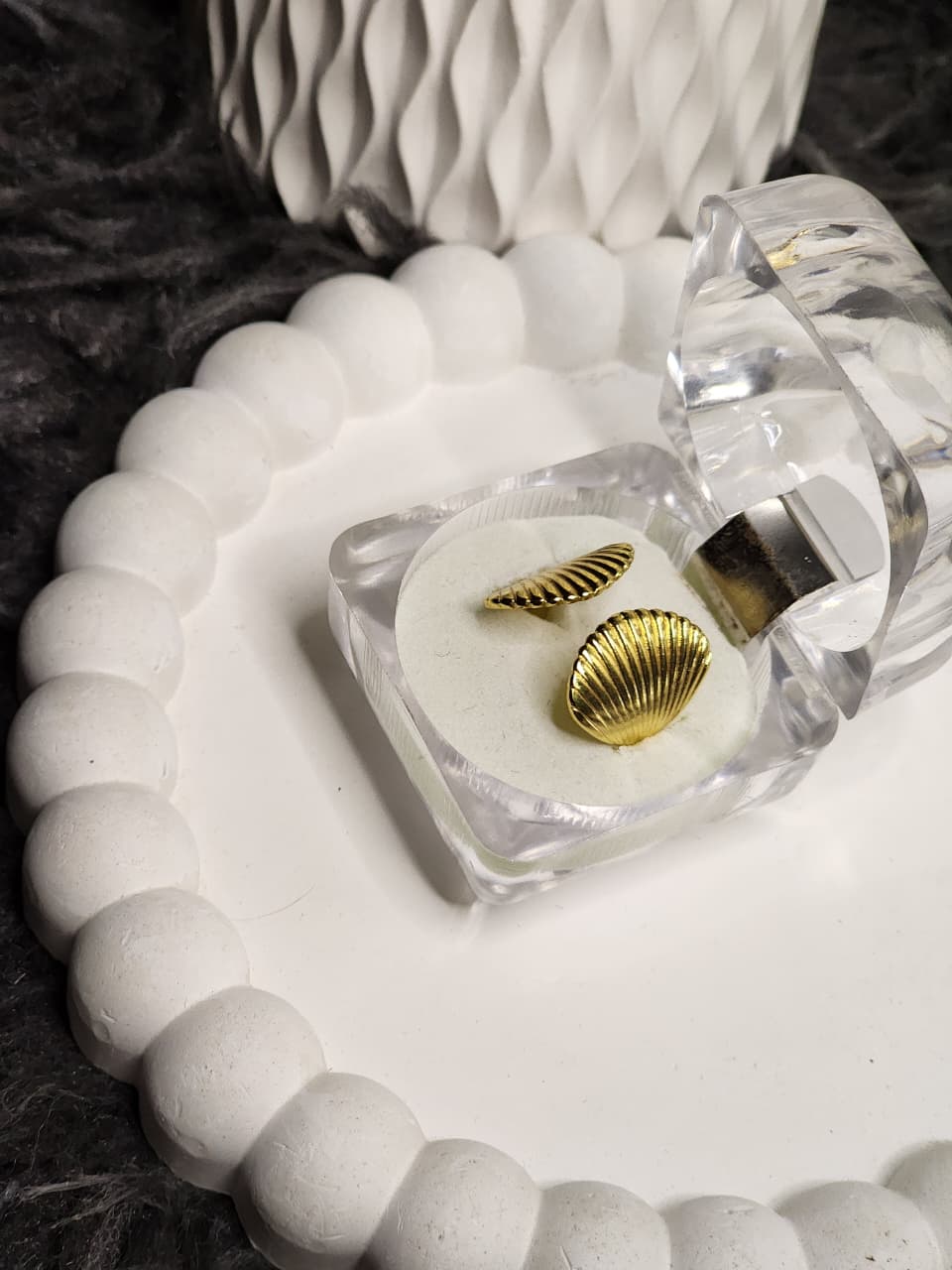 Gold scallop shell ring in clear gift box, side view