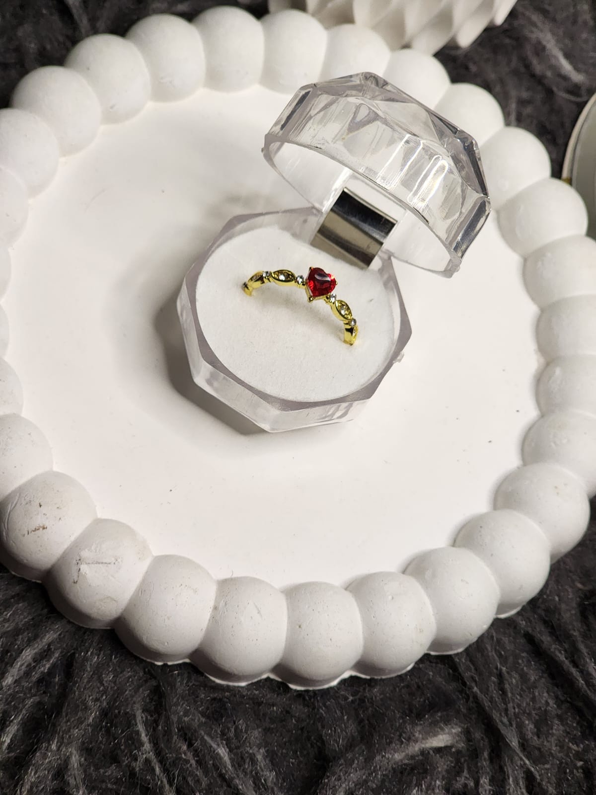 Red heart CZ gold ring in crystal box - angle view
