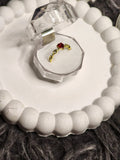 Red heart CZ gold ring in crystal box - top view