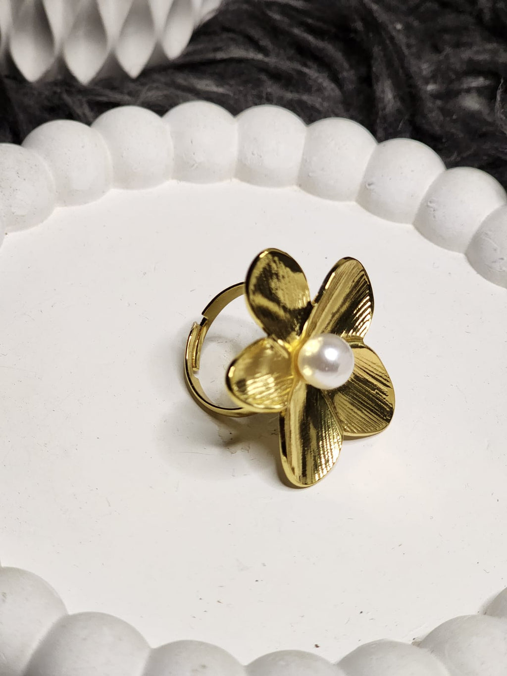Gold Petal Pearl Ring — top view on white display tray