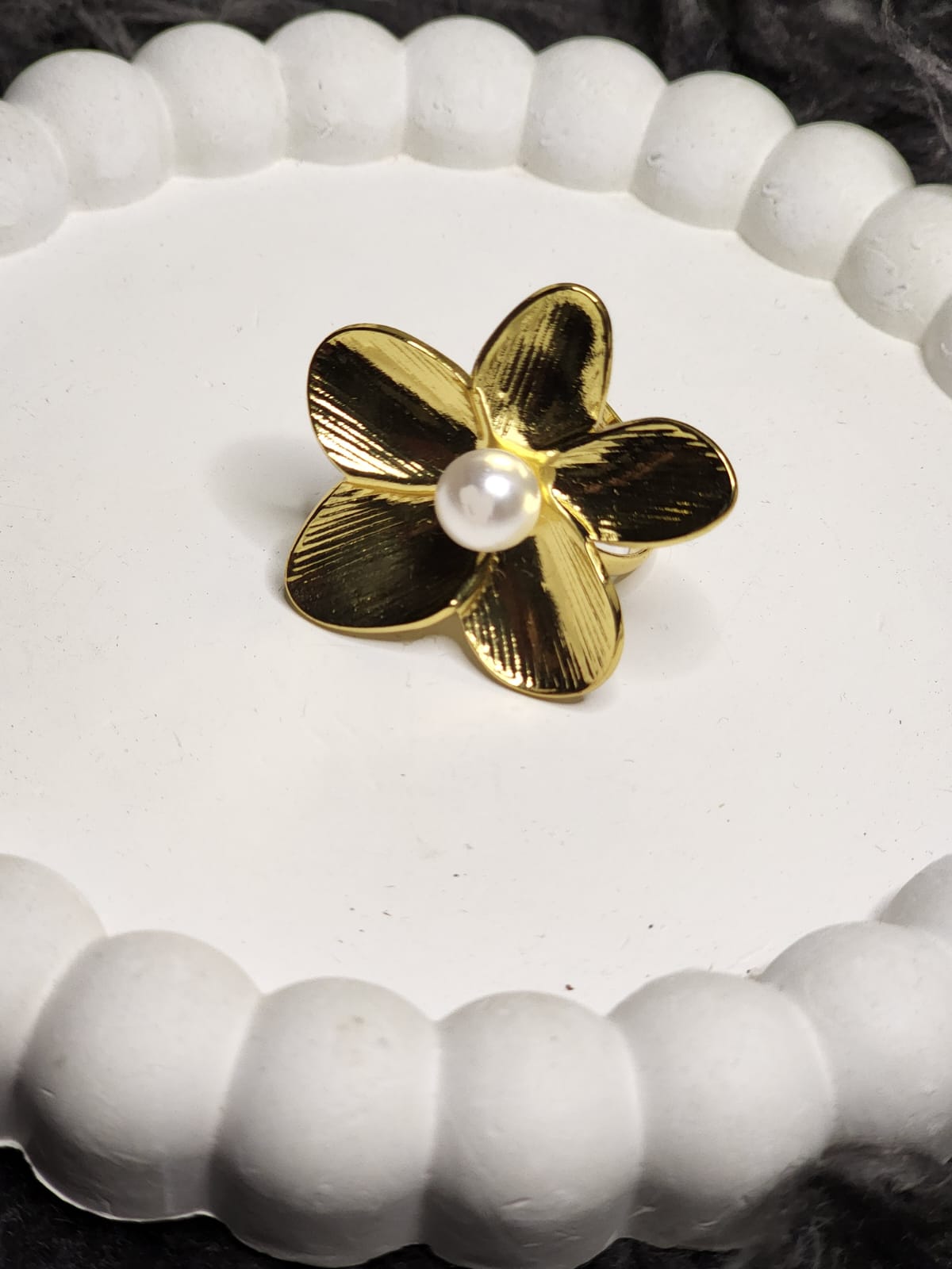 Gold Petal Pearl Ring — angled side view showing band and petal texture