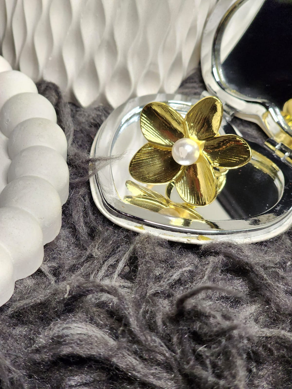 Gold Petal Pearl Ring — displayed in open heart-shaped compact mirror