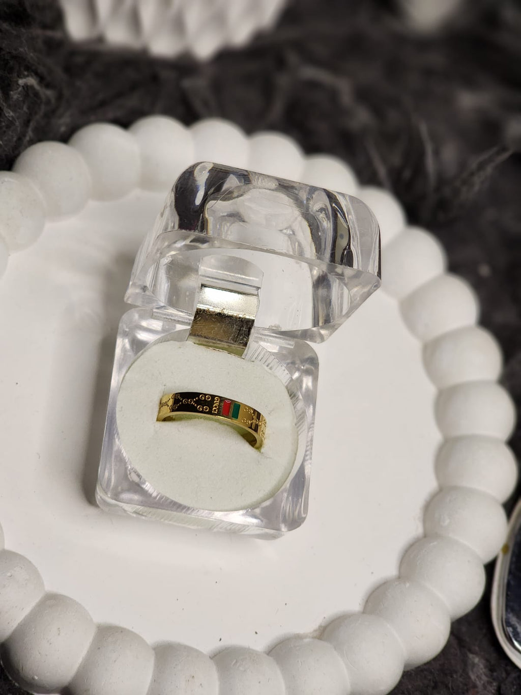 Gold stripe band ring detail shot in open gift box
