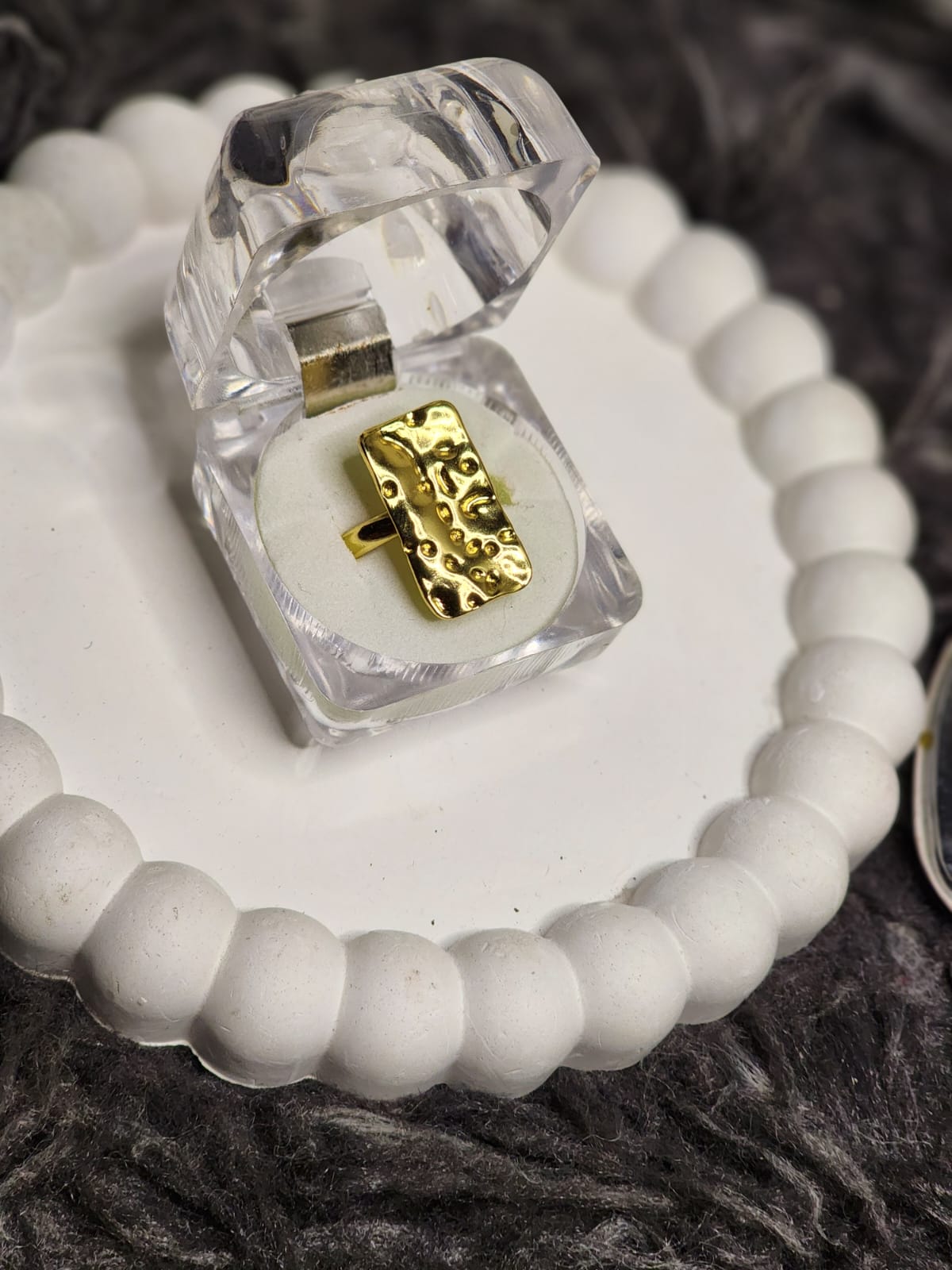 Gold stripe band ring in clear acrylic gift box on white scalloped tray