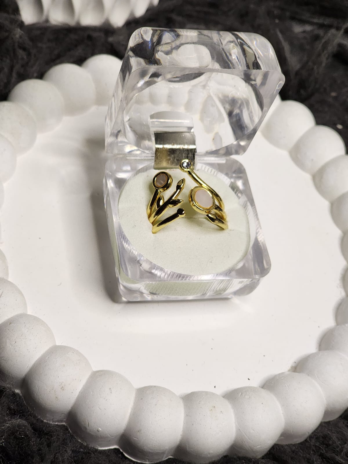 Gold branch open stone ring in clear acrylic gift box on white scalloped tray
