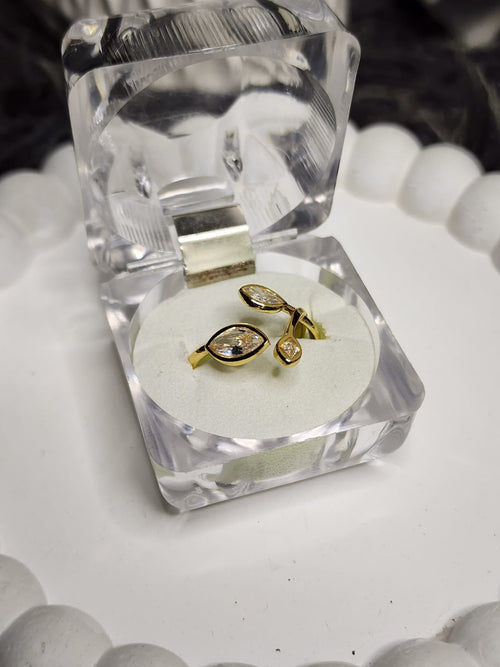 Crystal leaf marquise ring close up in open acrylic gift box