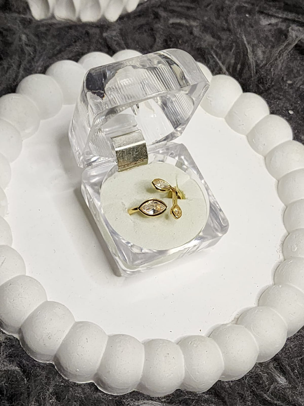 Crystal leaf marquise ring in clear acrylic gift box on white scalloped tray